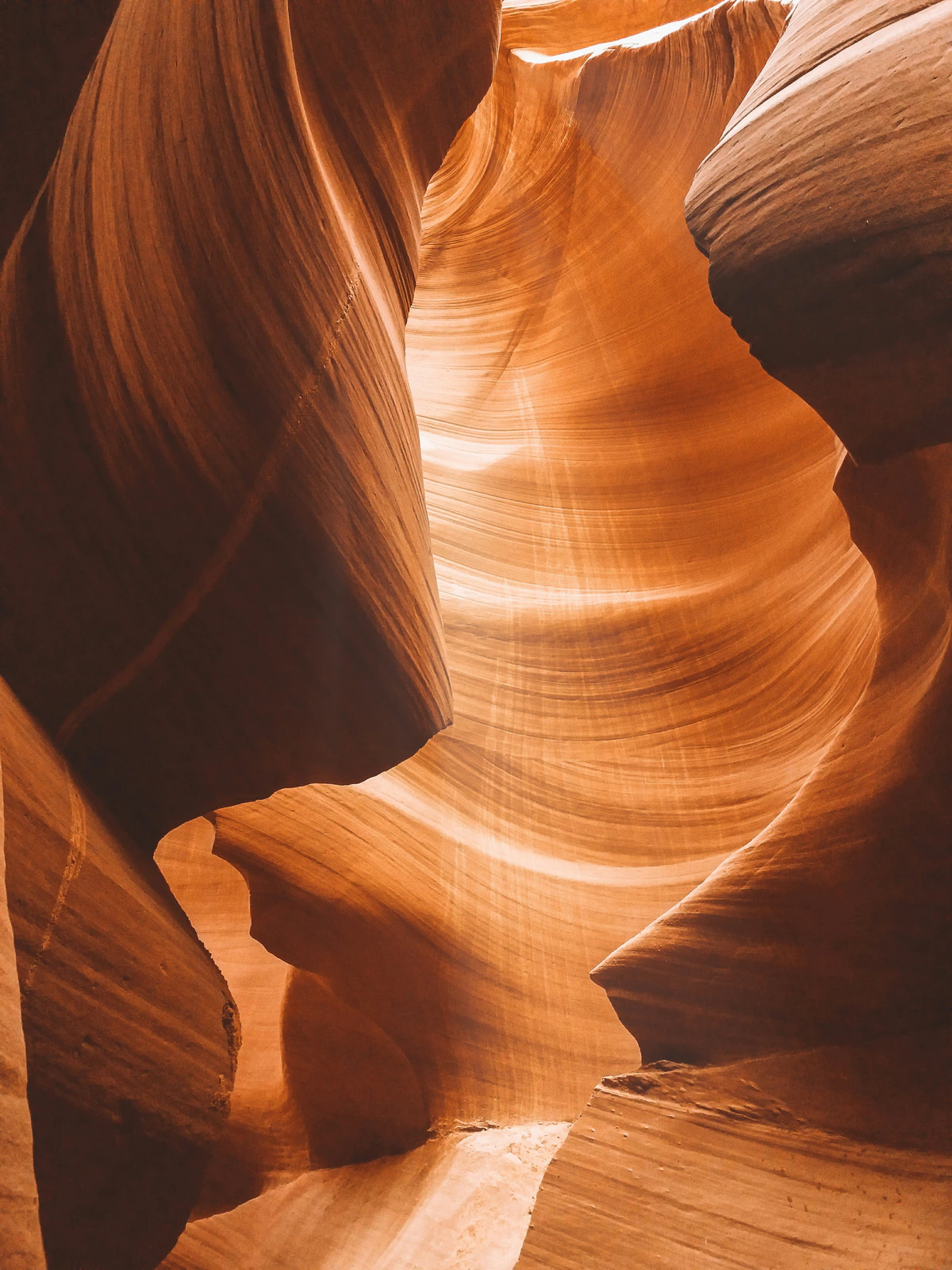 Golden layered sandstone walls glowing in Antelope Canyon