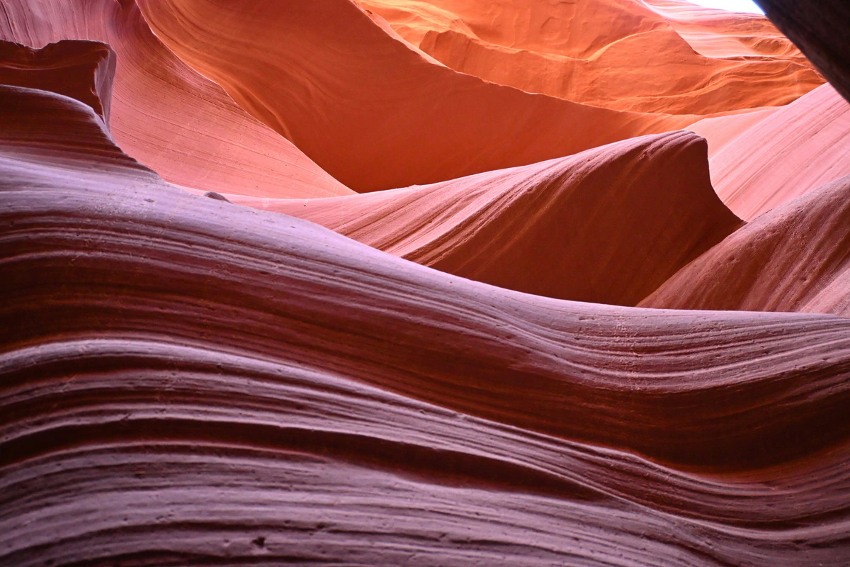 Wave-like bands of red sandstone inside Antelope Canyon